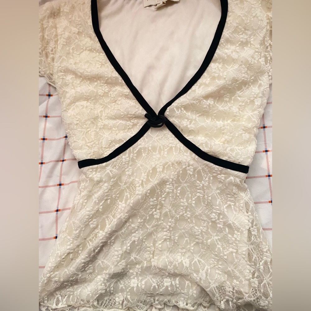 Elegant Cream Lace Blouse with Black Trim